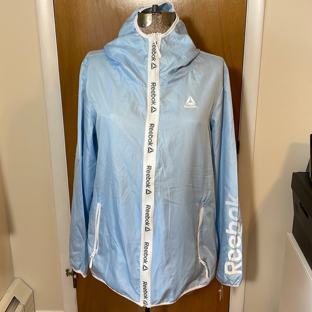 Reebok NWT Womens XL Light Blue Windbreaker with Hood and Pockets
